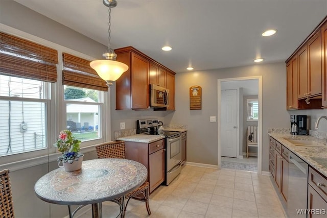 150 Lorfield Dr, Amherst, NY 14226 - kitchen featuring stainless steel appliances, plenty of natural light, recessed lighting, and brown cabinetry
