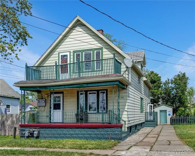 143 Reo Ave, Cheektowaga, NY 14211 - view of front of home featuring a porch, a balcony, and a chimney