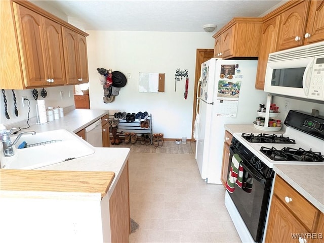11030 Roosevelt Hwy, Yates, NY 14098 - kitchen featuring white appliances, light countertops, and light flooring