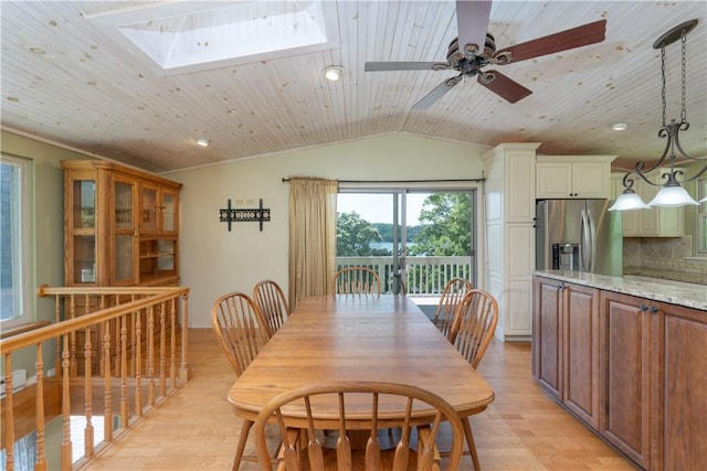 5343 Cedarwood Ln, Conesus, NY 14435 - dining space with lofted ceiling, light wood-style flooring, a skylight, wood ceiling, and a ceiling fan