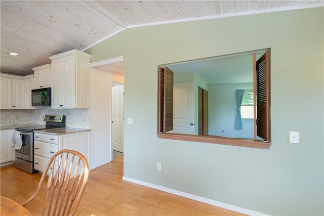 5343 Cedarwood Ln, Conesus, NY 14435 - kitchen with electric stove, black microwave, light wood-style flooring, decorative backsplash, and white cabinetry