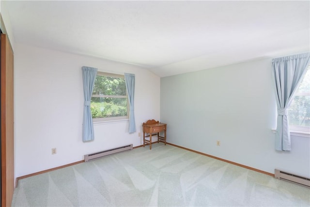 5343 Cedarwood Ln, Conesus, NY 14435 - empty room with a baseboard radiator, light carpet, and vaulted ceiling