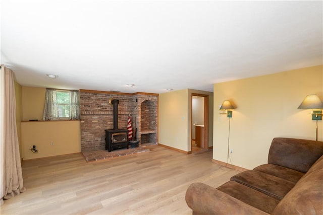5343 Cedarwood Ln, Conesus, NY 14435 - living room featuring a wood stove and light wood finished floors