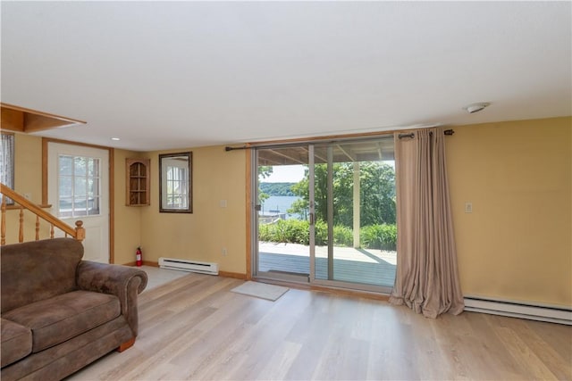 5343 Cedarwood Ln, Conesus, NY 14435 - living area featuring a baseboard radiator and light wood finished floors