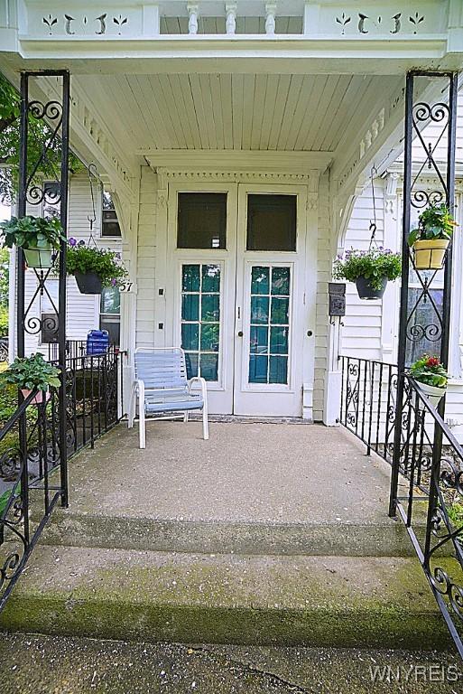 57 Christiana St, North Tonawanda, NY 14120 - property entrance with covered porch and french doors
