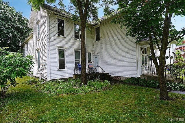 57 Christiana St, North Tonawanda, NY 14120 - view of front facade with a front lawn