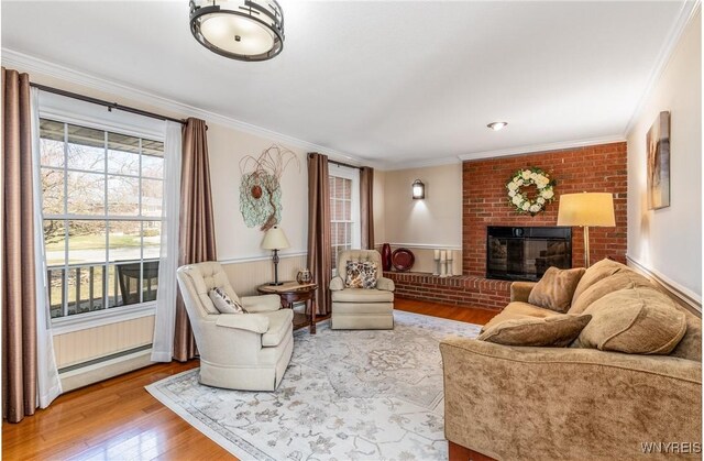 288 W Maplemere Rd, Amherst, NY 14221 - living area featuring wood finished floors, ornamental molding, baseboard heating, and a fireplace