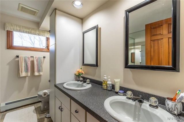 288 W Maplemere Rd, Amherst, NY 14221 - full bath with baseboard heating, double vanity, and tile patterned floors