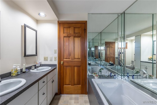 288 W Maplemere Rd, Amherst, NY 14221 - bathroom featuring double vanity and a bath