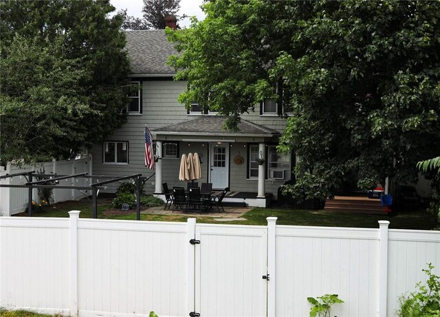 459 W Water St, Elmira City, NY 14905 - view of front of property with a shingled roof, a fenced backyard, and a gate