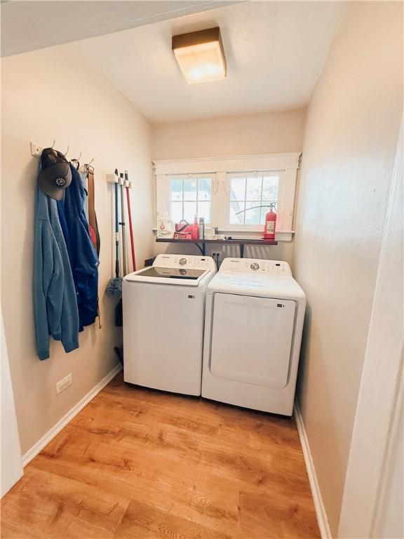 459 W Water St, Elmira City, NY 14905 - laundry area with washer and clothes dryer and light wood finished floors