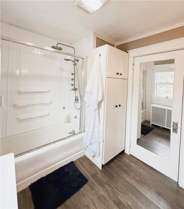 459 W Water St, Elmira City, NY 14905 - bathroom with radiator, wood finished floors, and combined bath / shower with glass door