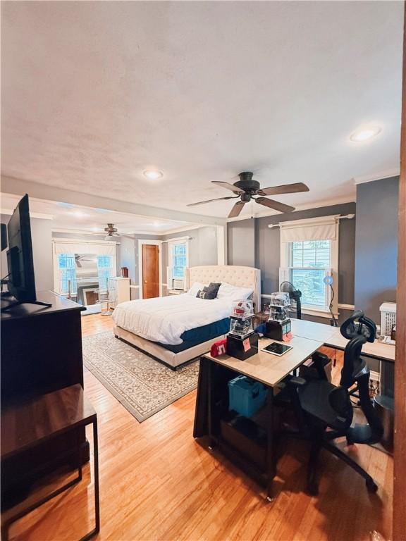 459 W Water St, Elmira City, NY 14905 - bedroom with light wood-style flooring, a desk, recessed lighting, a ceiling fan, and ornamental molding