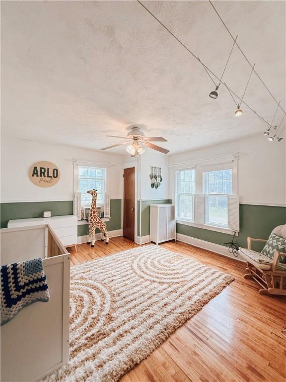 459 W Water St, Elmira City, NY 14905 - living area featuring a ceiling fan and wood finished floors