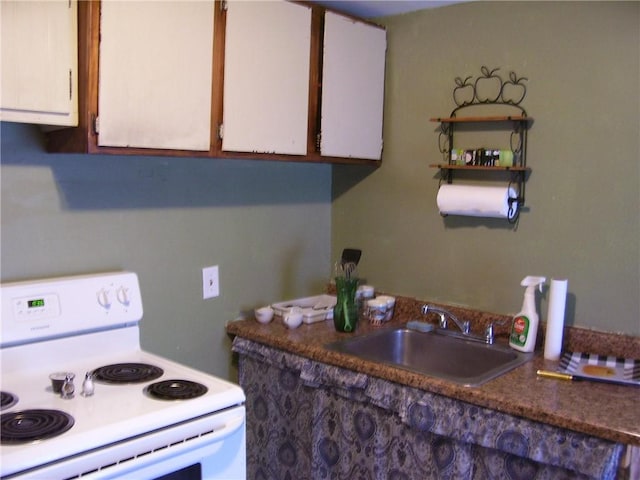 30 Mitchell St, Norwich, NY 13815 - kitchen featuring white electric range oven, white cabinetry, and dark countertops