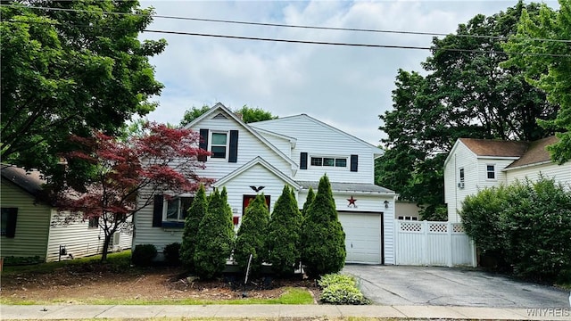 350 S 2nd St, Lewiston, NY 14092 - view of front facade featuring asphalt driveway and an attached garage