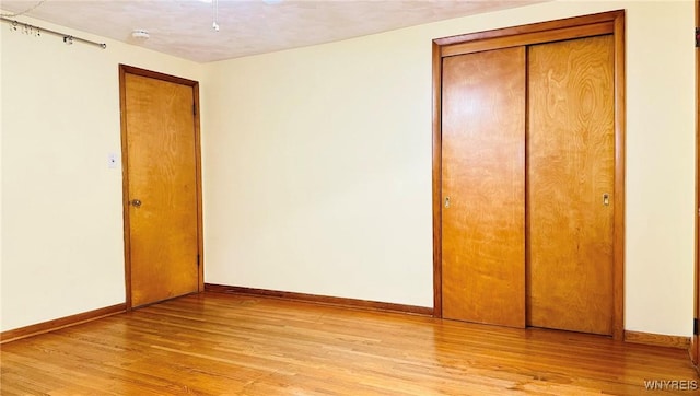 350 S 2nd St, Lewiston, NY 14092 - unfurnished bedroom with light wood-style flooring and a closet