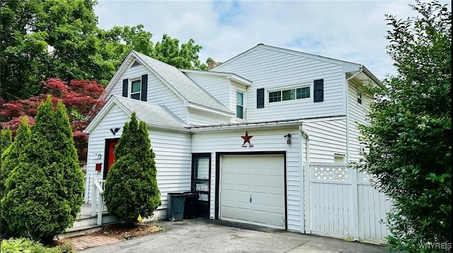 350 S 2nd St, Lewiston, NY 14092 - view of front facade with driveway, a chimney, and roof with shingles