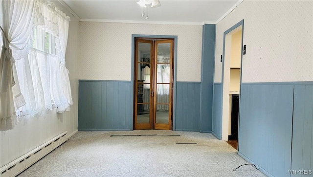 350 S 2nd St, Lewiston, NY 14092 - carpeted spare room with baseboard heating, wainscoting, and ornamental molding