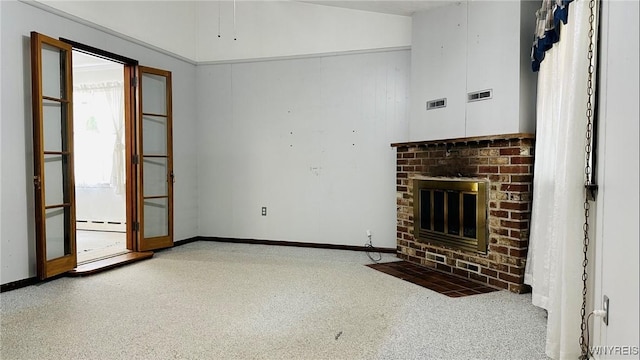 350 S 2nd St, Lewiston, NY 14092 - unfurnished living room featuring a baseboard heating unit and a brick fireplace