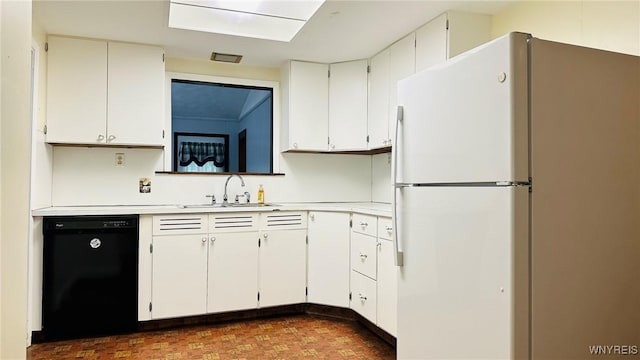 350 S 2nd St, Lewiston, NY 14092 - kitchen with freestanding refrigerator, dishwasher, light countertops, and white cabinetry