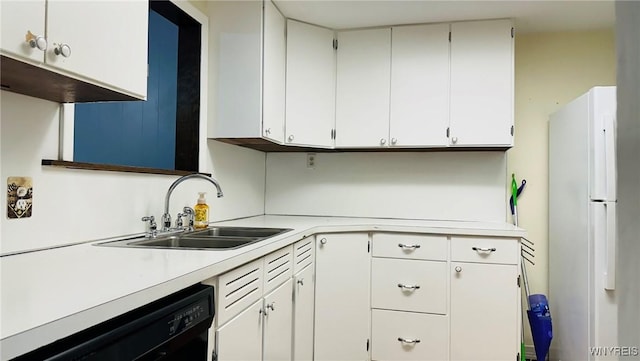 350 S 2nd St, Lewiston, NY 14092 - kitchen with freestanding refrigerator, black dishwasher, light countertops, and white cabinetry