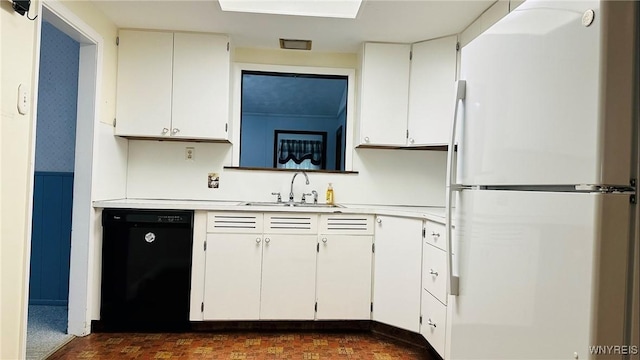 350 S 2nd St, Lewiston, NY 14092 - kitchen with freestanding refrigerator, dishwasher, light countertops, white cabinets, and wainscoting