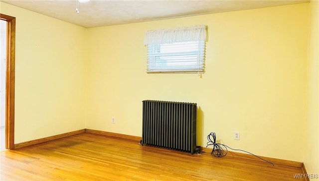 350 S 2nd St, Lewiston, NY 14092 - empty room featuring radiator and light wood-style flooring