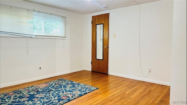 350 S 2nd St, Lewiston, NY 14092 - empty room with wood finished floors and a smoke detector