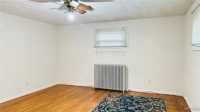 350 S 2nd St, Lewiston, NY 14092 - spare room featuring radiator, a ceiling fan, and wood finished floors