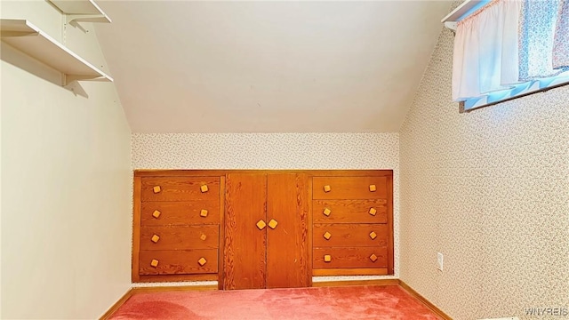 350 S 2nd St, Lewiston, NY 14092 - unfurnished bedroom with vaulted ceiling, wallpapered walls, and carpet