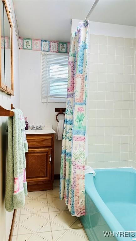 350 S 2nd St, Lewiston, NY 14092 - bathroom with vanity, shower / bath combo, and tile patterned floors