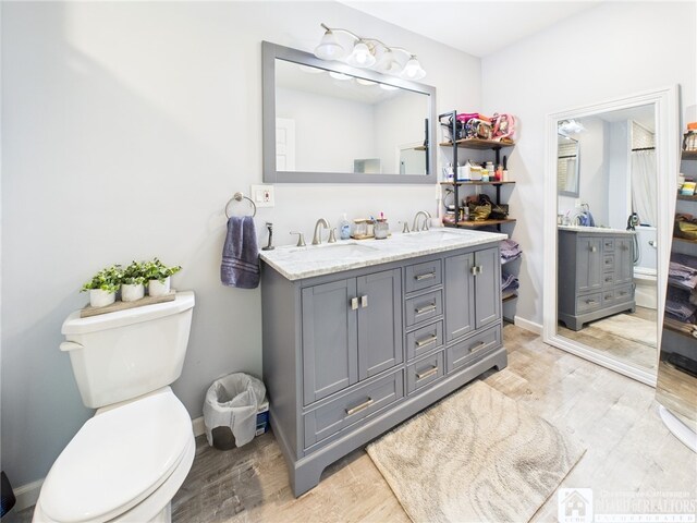 709 Main St, Olean, NY 14760 - bathroom with wood finished floors and double vanity