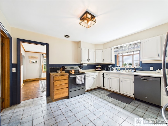 709 Main St, Olean, NY 14760 - kitchen featuring stainless steel appliances, light countertops, white cabinetry, and light tile patterned flooring