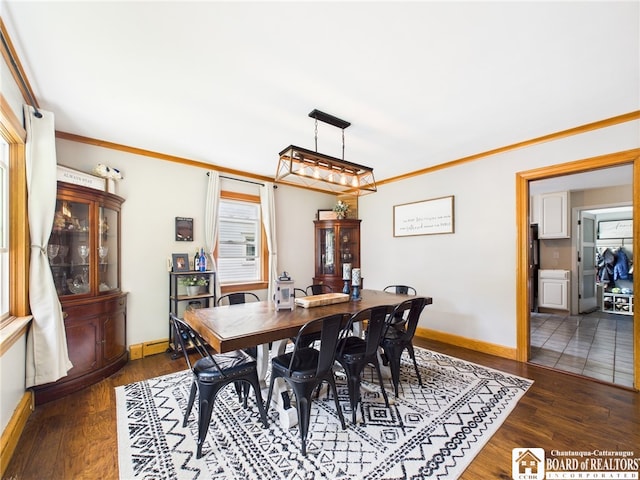 709 Main St, Olean, NY 14760 - dining room with dark wood-style floors and ornamental molding