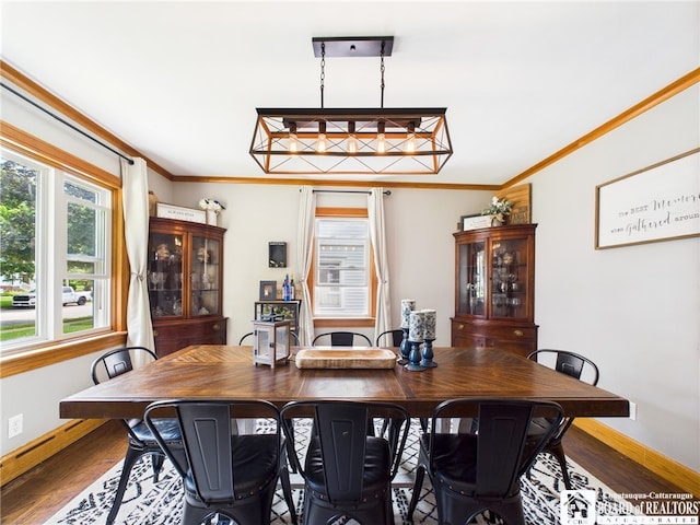 709 Main St, Olean, NY 14760 - dining space with wood finished floors and ornamental molding
