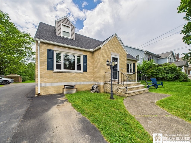 709 Main St, Olean, NY 14760 - view of front of home featuring brick siding, a front lawn, and roof with shingles
