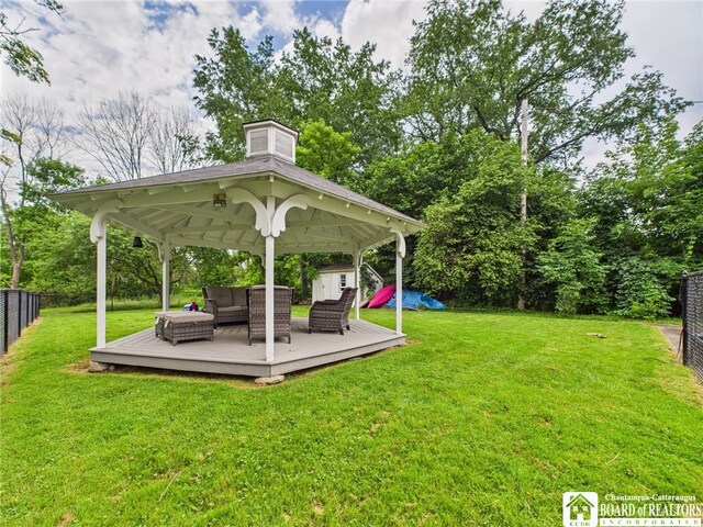 709 Main St, Olean, NY 14760 - fenced yard with outdoor lounge area, a gazebo, and a wooden deck