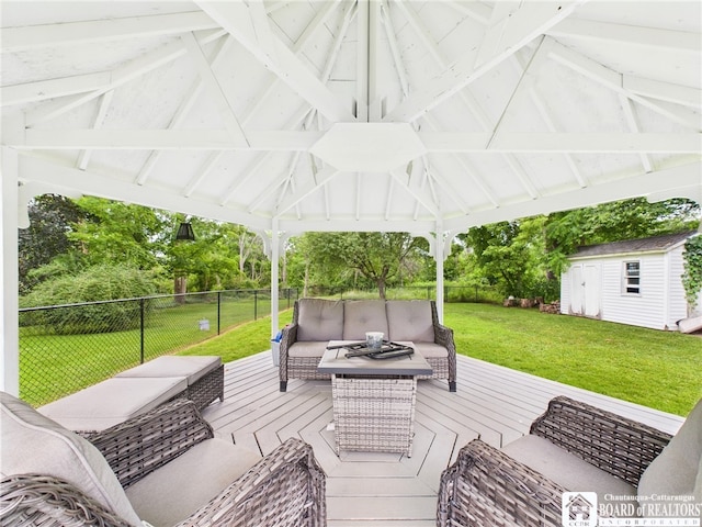 709 Main St, Olean, NY 14760 - wooden terrace featuring outdoor lounge area, a fenced backyard, a gazebo, and a shed