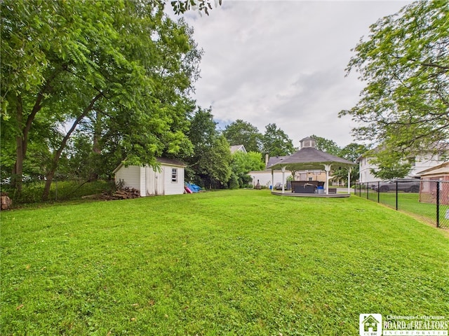709 Main St, Olean, NY 14760 - view of yard featuring a jacuzzi, a gazebo, and a storage unit