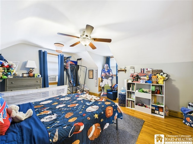 709 Main St, Olean, NY 14760 - bedroom featuring vaulted ceiling, wood finished floors, multiple windows, and a ceiling fan