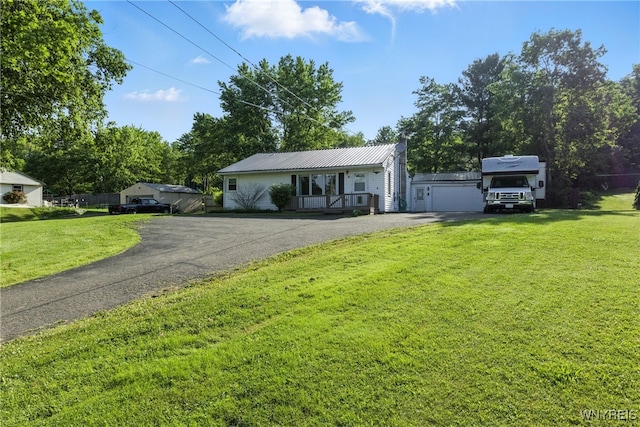 11583 Gowanda State Rd, North Collins, NY 14111 - single story home with asphalt driveway, a front yard, and a metal roof