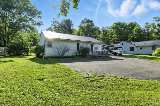 11583 Gowanda State Rd, North Collins, NY 14111 - single story home featuring asphalt driveway, a metal roof, and a front lawn