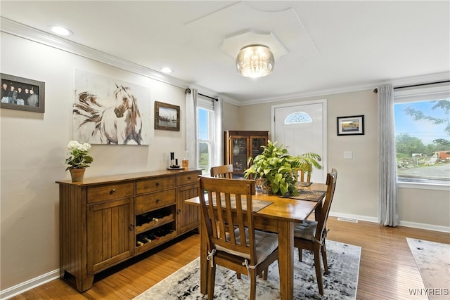 11583 Gowanda State Rd, North Collins, NY 14111 - dining space with ornamental molding and light wood finished floors