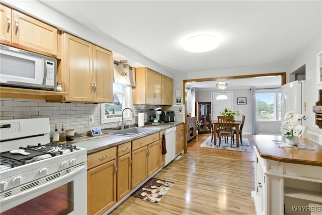 11583 Gowanda State Rd, North Collins, NY 14111 - kitchen with white appliances, light wood-style flooring, backsplash, and light countertops
