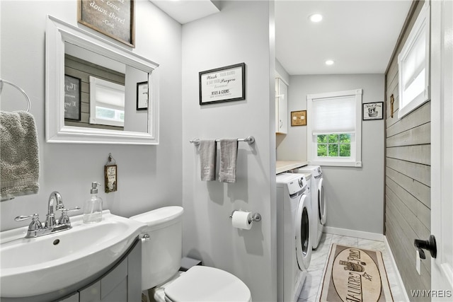 11583 Gowanda State Rd, North Collins, NY 14111 - half bathroom with washing machine and dryer, marble look tile flooring, vanity, and recessed lighting