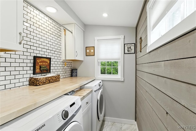 11583 Gowanda State Rd, North Collins, NY 14111 - laundry area featuring cabinet space, washer and dryer, light marble finish flooring, and recessed lighting