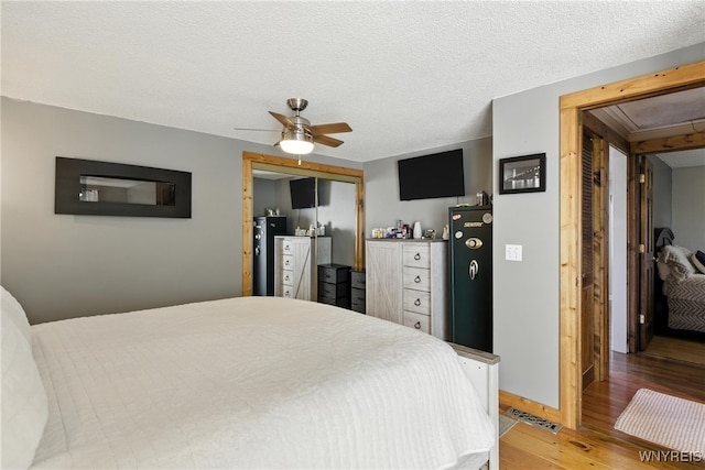 11583 Gowanda State Rd, North Collins, NY 14111 - bedroom featuring light wood-type flooring, a closet, a ceiling fan, and attic access