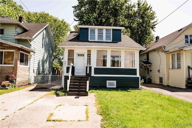 807 Tifft St, Buffalo, NY 14220 - bungalow-style house featuring entry steps, a gate, a shingled roof, and driveway