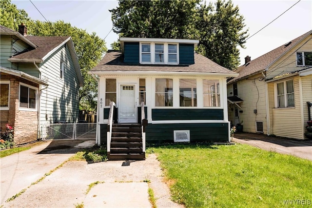 807 Tifft St, Buffalo, NY 14220 - bungalow-style home with a gate and a shingled roof
